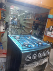 Gazinière Yücel 4 Feux Inox avec Mini-Four  vue de profil